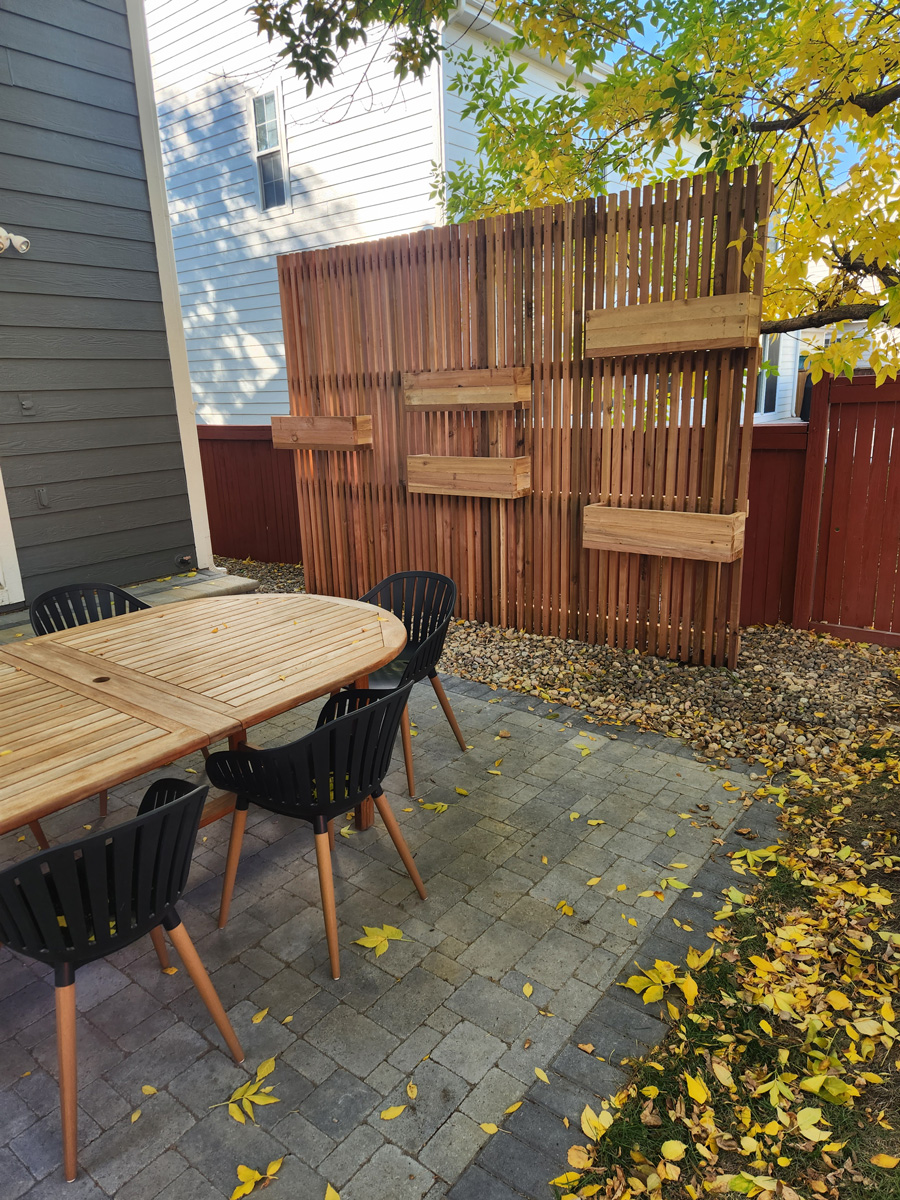 Vertical wooden planting wall built by Linden Leaf Landscapes