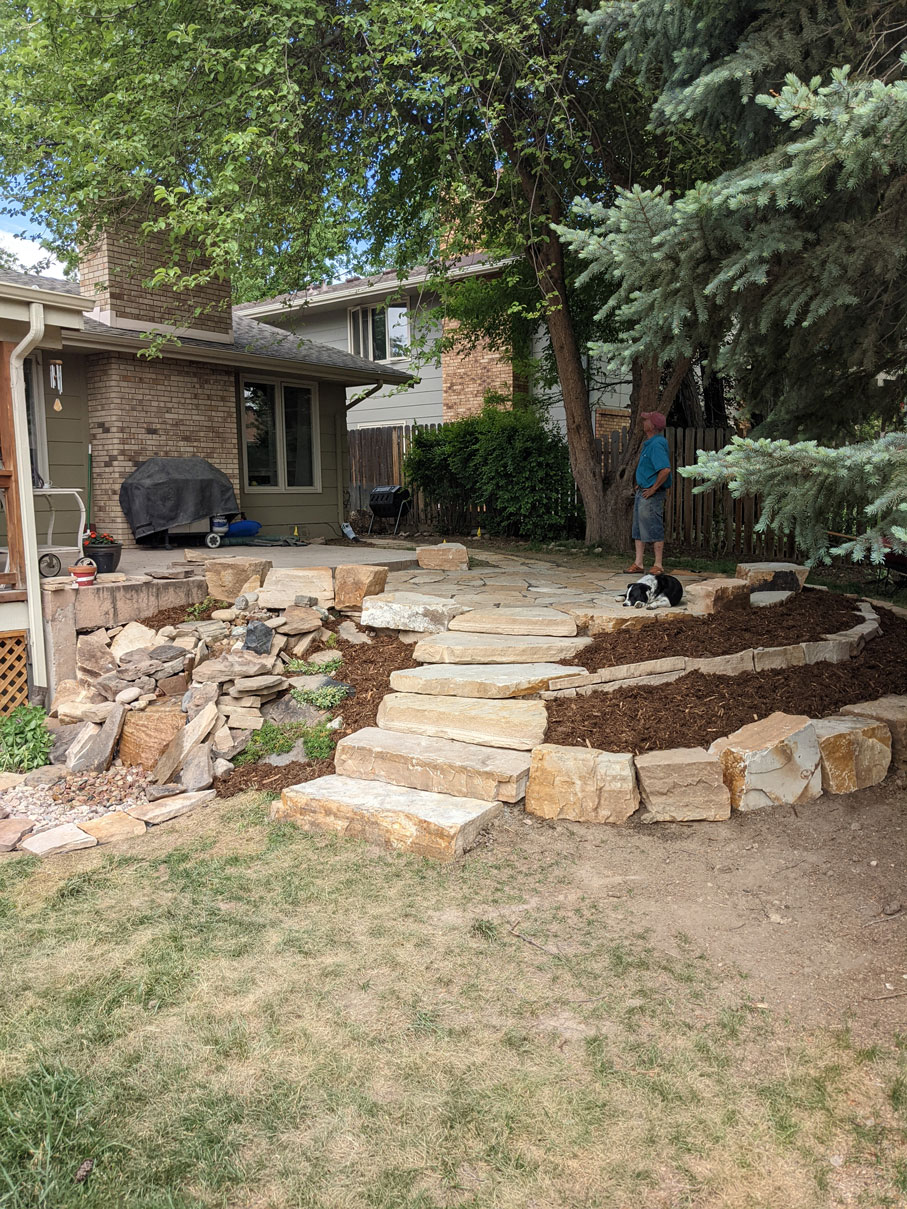 Stone steps and a stone pathway in front of a home in Fort Collins