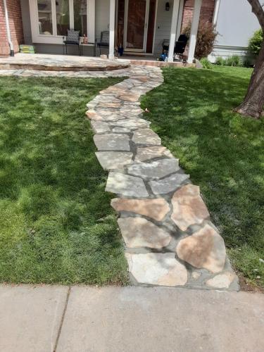 Flagstone pathway in grass in Fort Collins