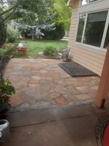 Flagstone patio in backyard design project in Fort Collins 