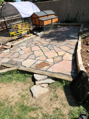Colorful stone patio installation by Linden Leaf Landscapes in Fort Collins