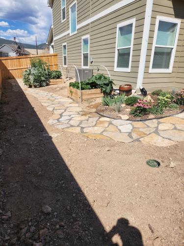 Flagstone walkway and outdoor landscaping in Fort Collins