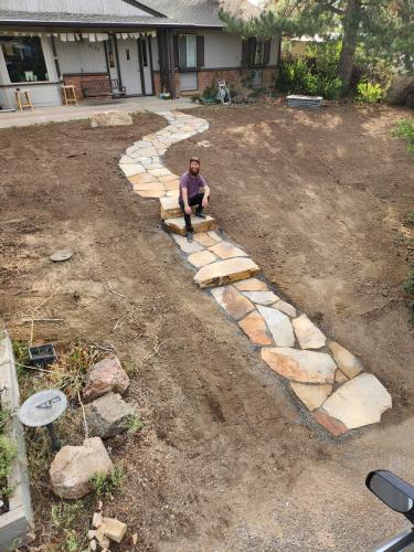 Satisfied customer of Linden Leaf Landscapes with his new stone pathway and staircase