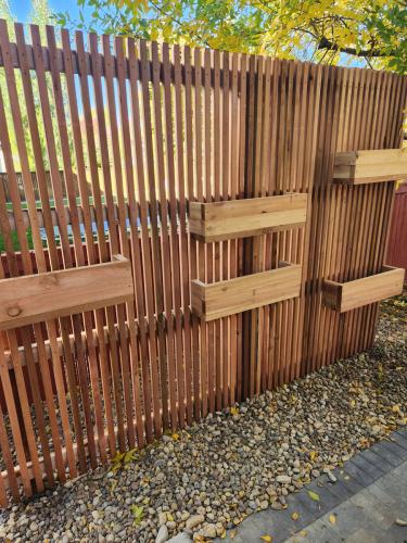 Wooden planting wall with planter beds in Fort Collins