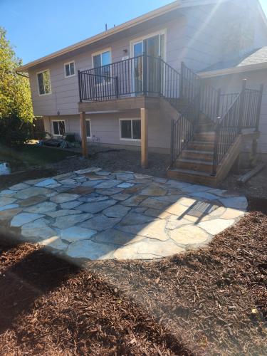 Stone patio with mulch landscape design