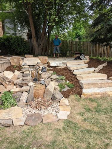 Fort Collins hardscape patio design with stone and mulch