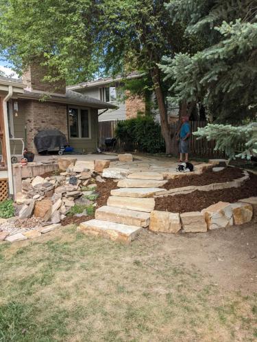 Hardscape design patio with stone steps and mulch