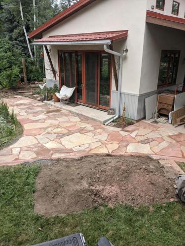 Stone patio hardscape design in Colorado