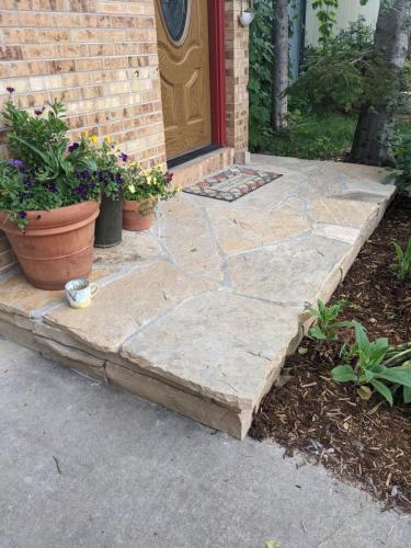Stone porch hardscape design in Fort Collins