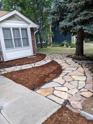 Hardscape stone pathway with mulch landscaping in Fort Collins, Colorado