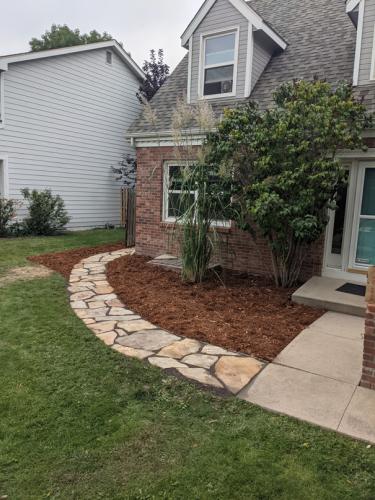 Stone pathway and lawn landscape design in Fort Collins, Colorado