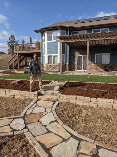 Mulch and rock landscape design with stone pathway in Fort Collins, CO