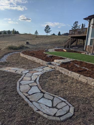 Flagstone pathway at a home in Fort Collins by Linden Leaf Landscapes 