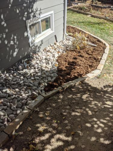 Xeriscape planter bed with rocks and mulch in Fort Collins