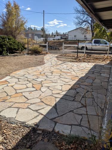 A large flagstone patio design in Colorado by Linden Leaf Landscapes