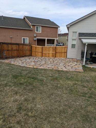 A custom patio made of flagstone by Linden Leaf Landscapes in Fort Collins