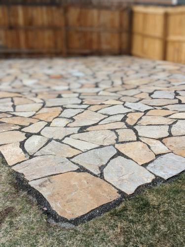 A close up of flagstone patio by Linden Leaf Landscapes in Fort Collins