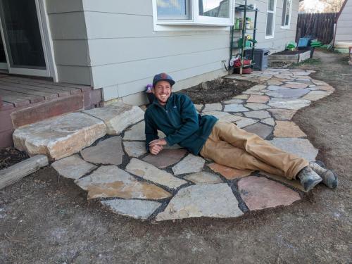 Linden Hunter of Linden Leaf Landscapes posing with stone pathway