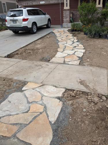 Stone pathway intersecting with concrete in Northern Colorado