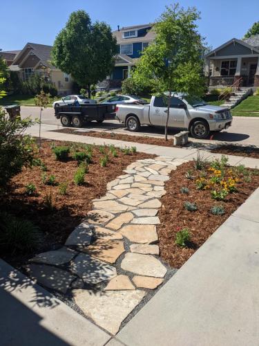 Flagstone patio and mulch landscaping in Colorado