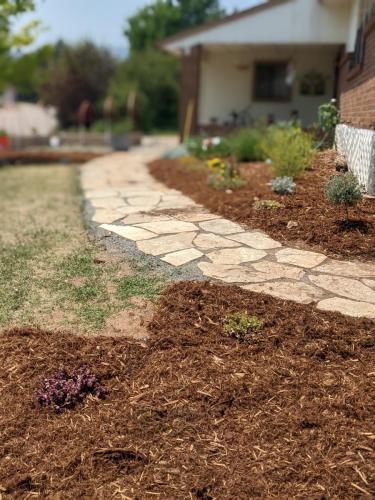 Flagstone patio and mulch design landscaping in Fort Collins