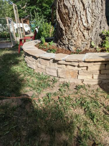 Raised stone planter bed landscape design in Northern Colorado