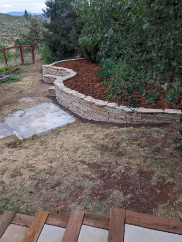 Raised stone planter bed landscape project in Fort Collins