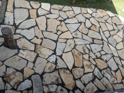 Large flagstone patio with variety of different stone sizes in Fort Collins