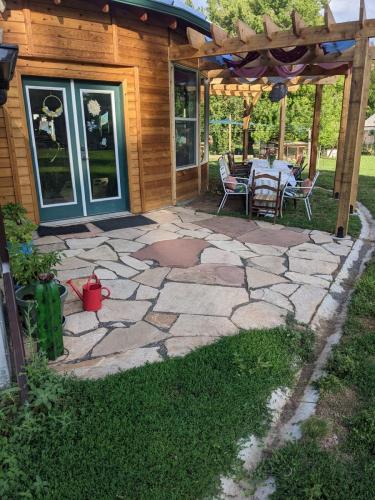 Backyard stone patio in Fort Collins by Linden Leaf Landscapes