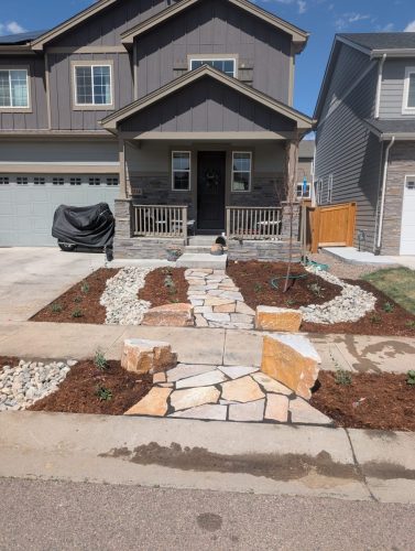 Fort Collins front yard xeriscape design with large stones and rock pathway